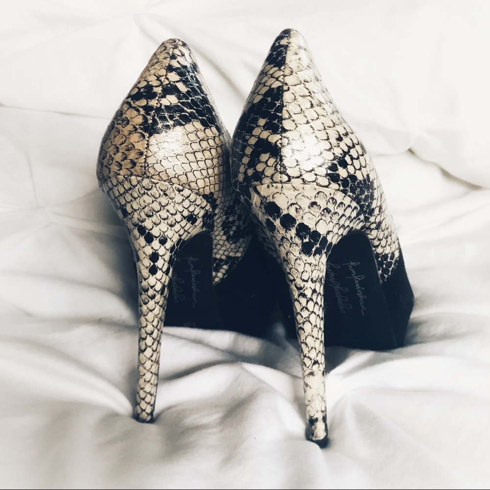 Black and snake skin pumps
